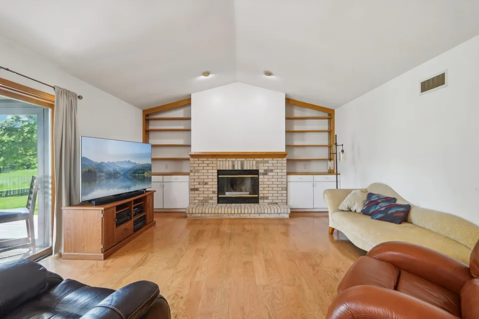 Warm living room with fireplace at Mount Zion Care